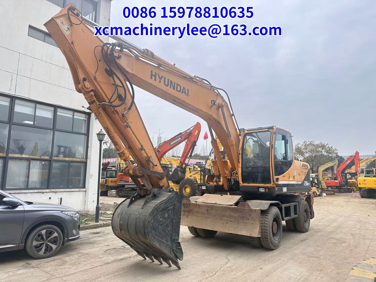 2022 Hyundai R210W-9 wheel excavator, front three-quarter view