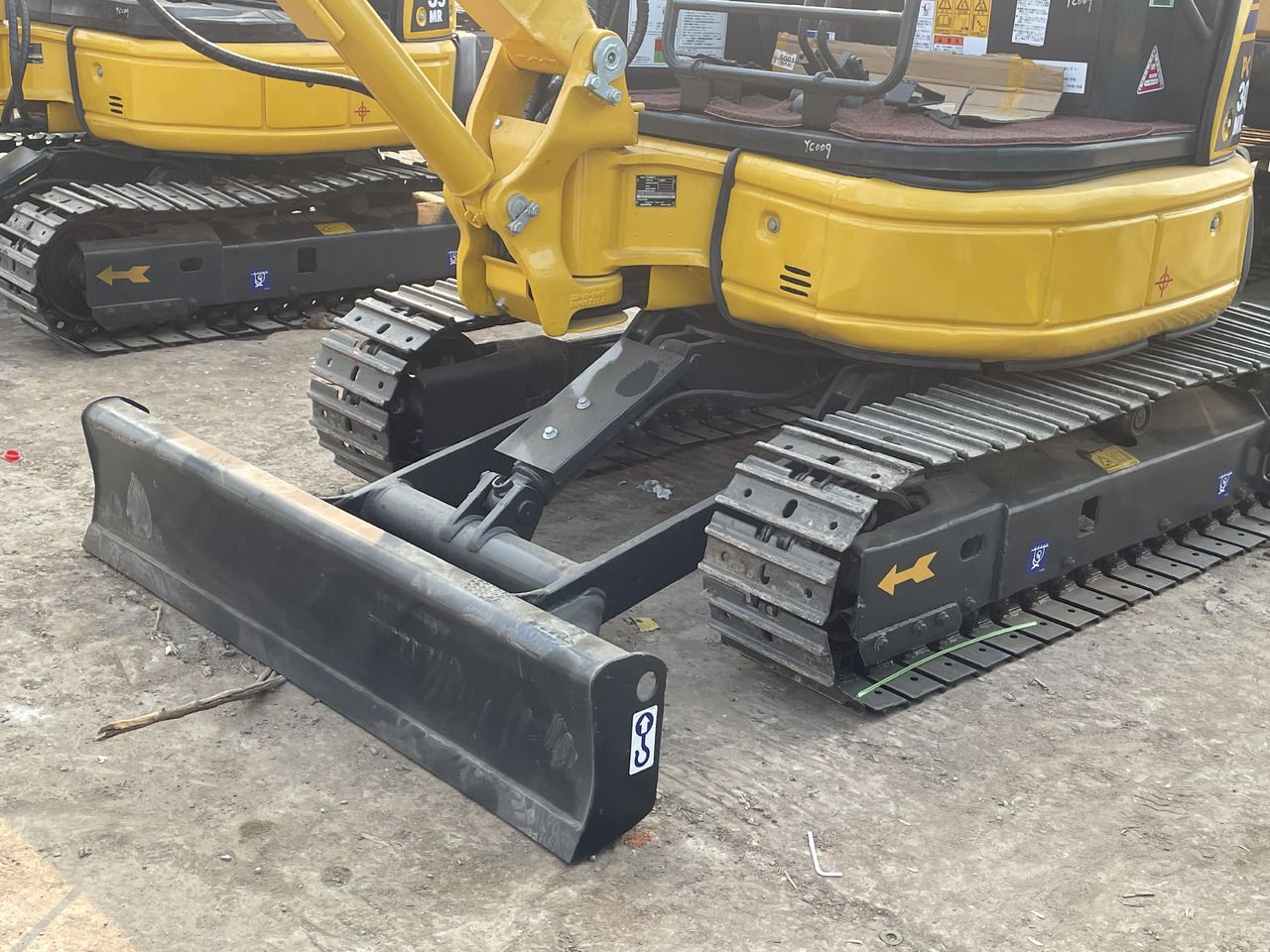 2023 Komatsu PC30MR-3 mini excavator front blade and undercarriage view 2023 Komatsu PC30MR-3 mini excavator front blade and undercarriage view