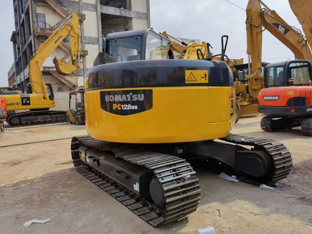 2022 Komatsu PC128US mini excavator, rear three-quarter view