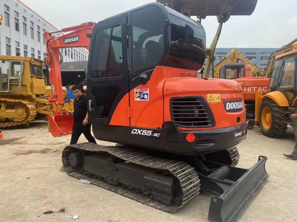 2023 Doosan DX55-9C mini excavator, front three-quarter view