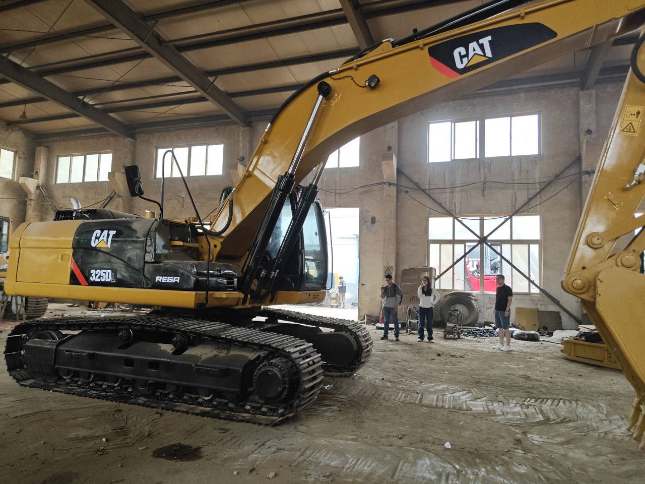Caterpillar 325DL crawler excavator, side view Caterpillar 325DL crawler excavator, side view