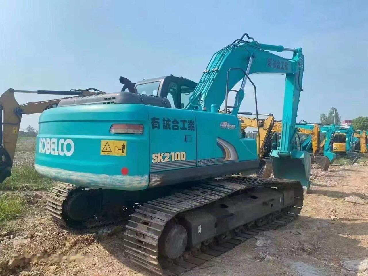 2018 Kobelco SK210D crawler excavator, rear three-quarter view 2018 Kobelco SK210D crawler excavator, rear three-quarter view