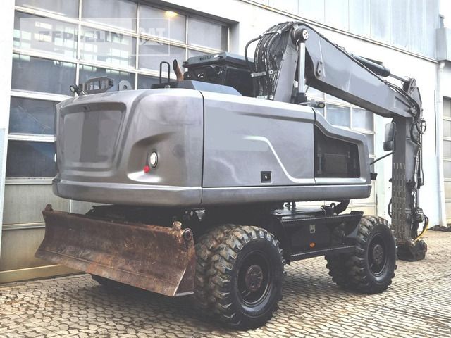 2020 Caterpillar M320F wheel excavator rear three-quarter view 2020 Caterpillar M320F wheel excavator rear three-quarter view