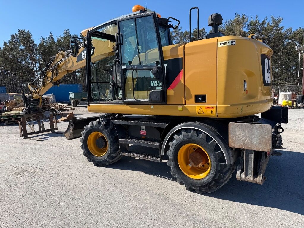 2016 Caterpillar M314F wheel excavator, rear three-quarter view 2016 Caterpillar M314F wheel excavator, rear three-quarter view