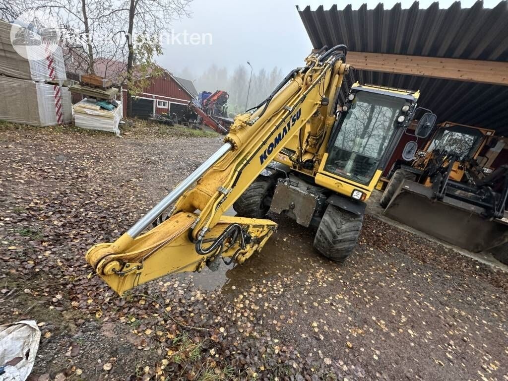 2014 Komatsu PW148-8 wheel excavator, front three-quarter view 2014 Komatsu PW148-8 wheel excavator, front three-quarter view