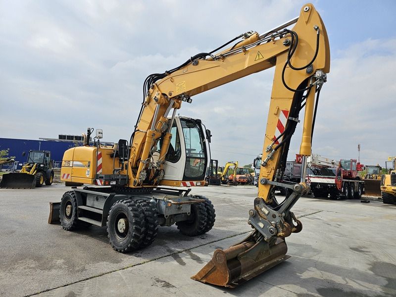 2012 Liebherr A316 LITRONIC wheel excavator side view 2012 Liebherr A316 LITRONIC wheel excavator side view