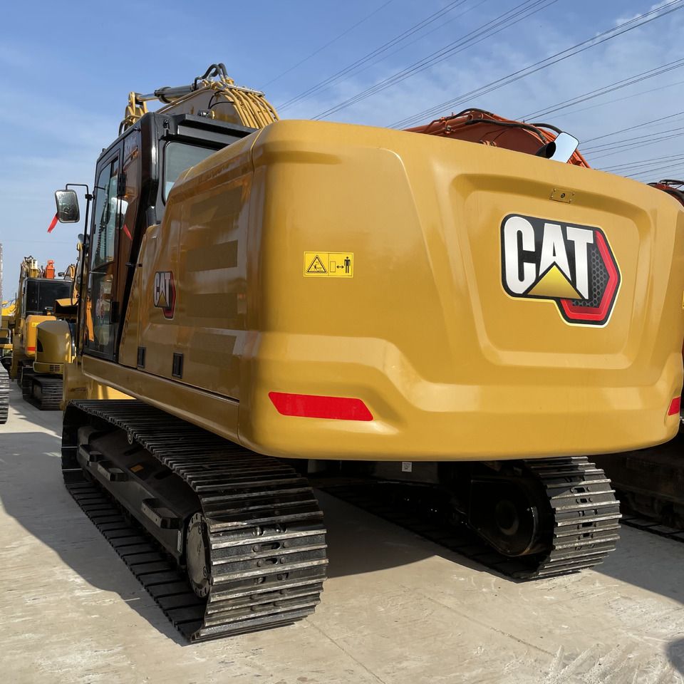 2023 Caterpillar 320GC crawler excavator, rear three-quarter view 2023 Caterpillar 320GC crawler excavator, rear three-quarter view