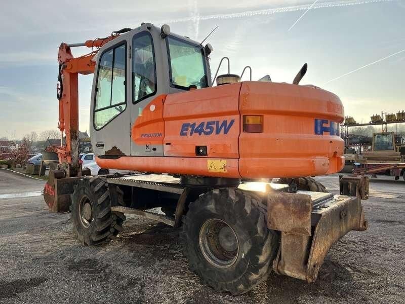 2004 Kobelco E145W wheel excavator, rear three-quarter view 2004 Kobelco E145W wheel excavator, rear three-quarter view