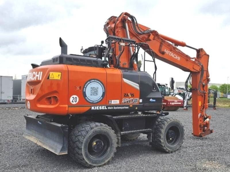 2021 Hitachi ZX180W-7 wheel excavator, rear three-quarter view 2021 Hitachi ZX180W-7 wheel excavator, rear three-quarter view