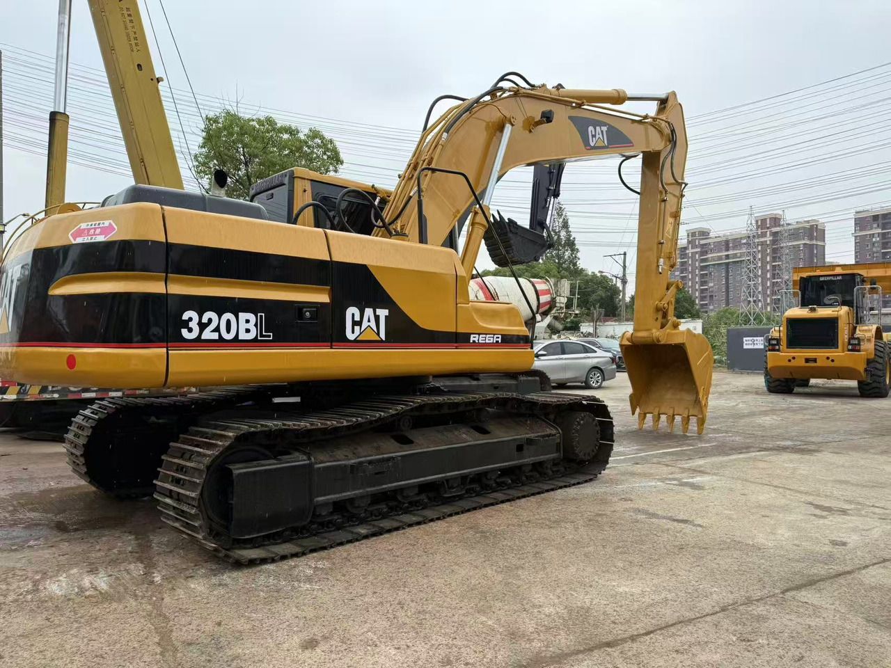 2010 Caterpillar 320BL crawler excavator, rear three-quarter view