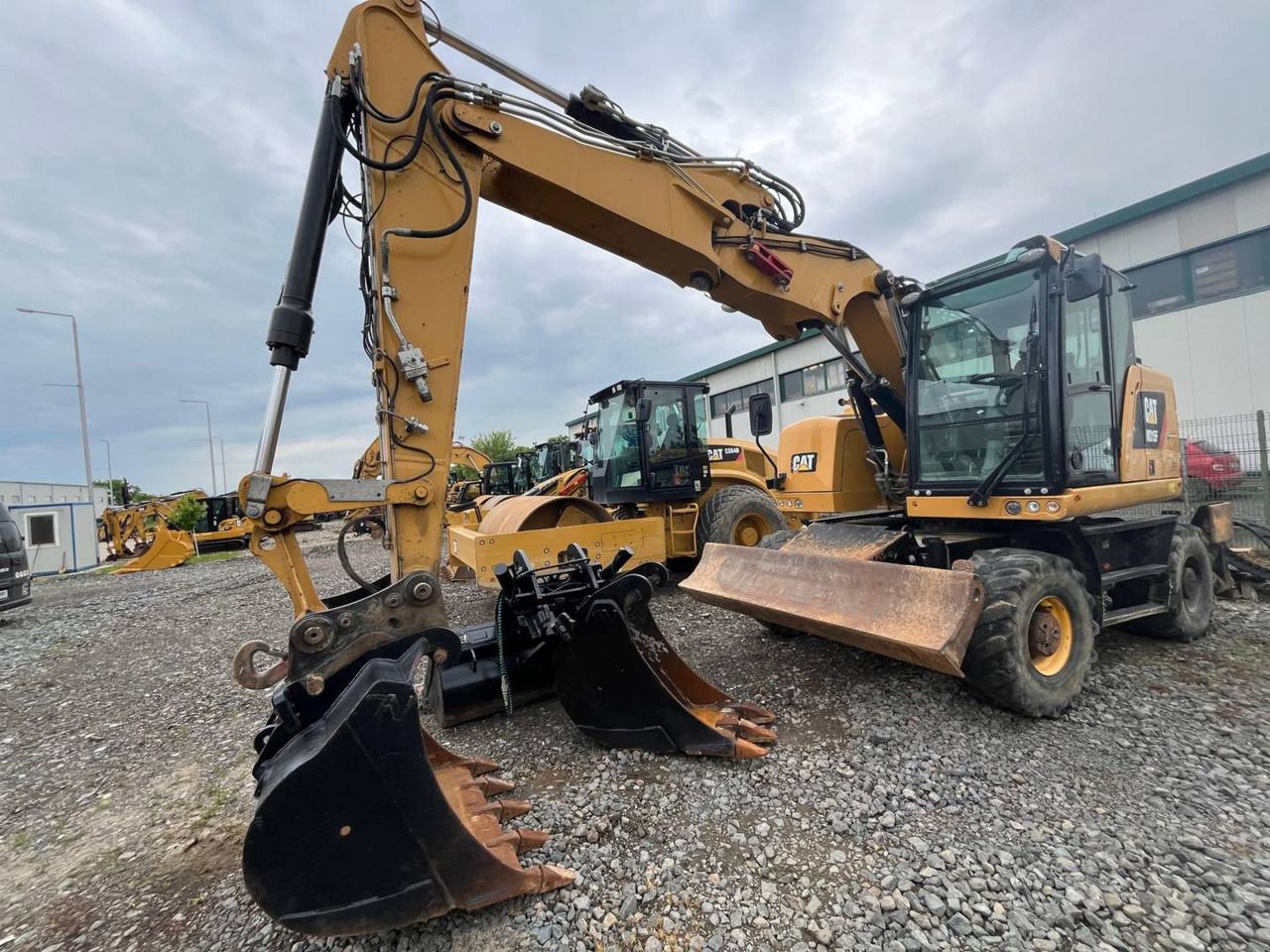 2018 Caterpillar M315F wheel excavator, front three-quarter view