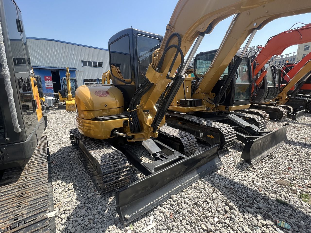 2022 Caterpillar 304CR mini excavator, rear three-quarter view