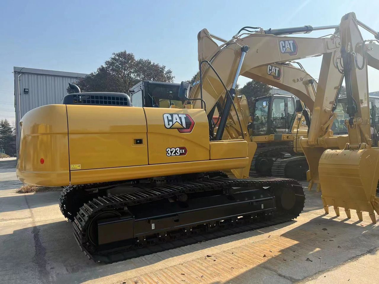 2026 Caterpillar 323GX crawler excavator, rear three-quarter view 2026 Caterpillar 323GX crawler excavator, rear three-quarter view