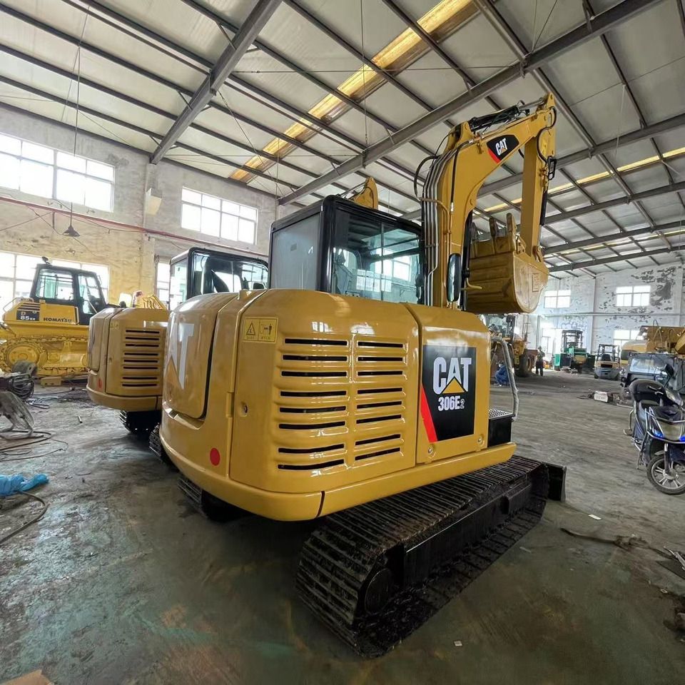 2023 Caterpillar 306E2 mini excavator rear three-quarter view 2023 Caterpillar 306E2 mini excavator rear three-quarter view