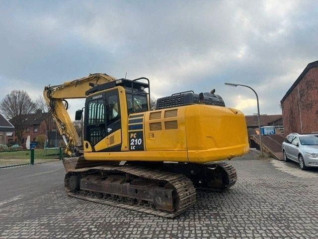 2017 Komatsu PC210LC-11 crawler excavator, rear three-quarter view 2017 Komatsu PC210LC-11 crawler excavator, rear three-quarter view