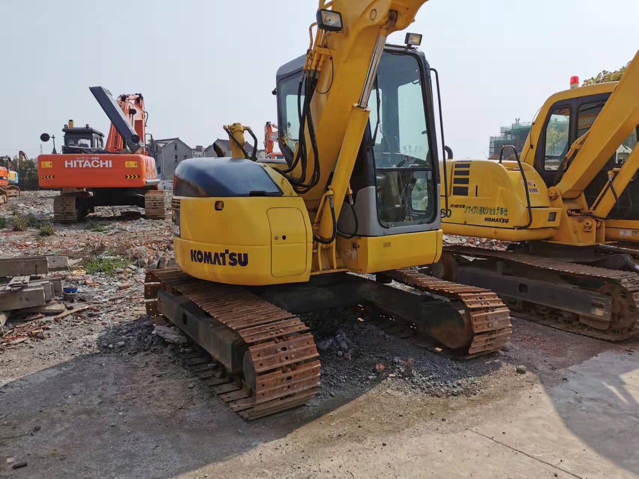 2023 Komatsu PC78US-6 excavator, rear three-quarter view 2023 Komatsu PC78US-6 excavator, rear three-quarter view