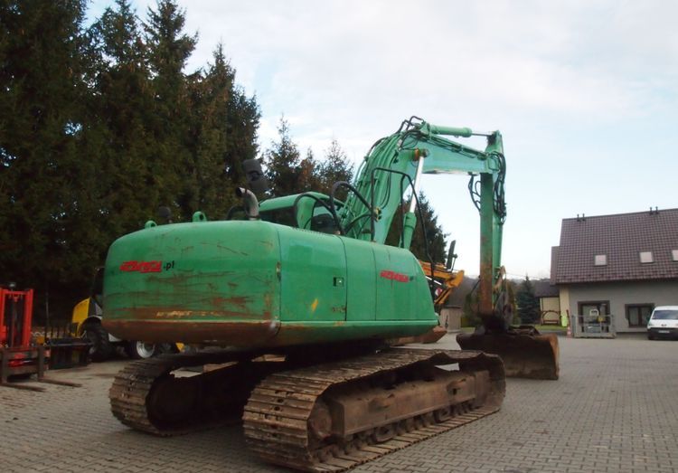2008 JCB JS210 crawler excavator, rear three-quarter view 2008 JCB JS210 crawler excavator, rear three-quarter view