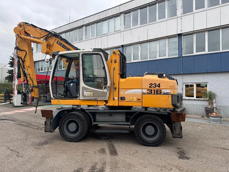 2009 Liebherr 316 LITRONIC material handler, side view 2009 Liebherr 316 LITRONIC material handler, side view