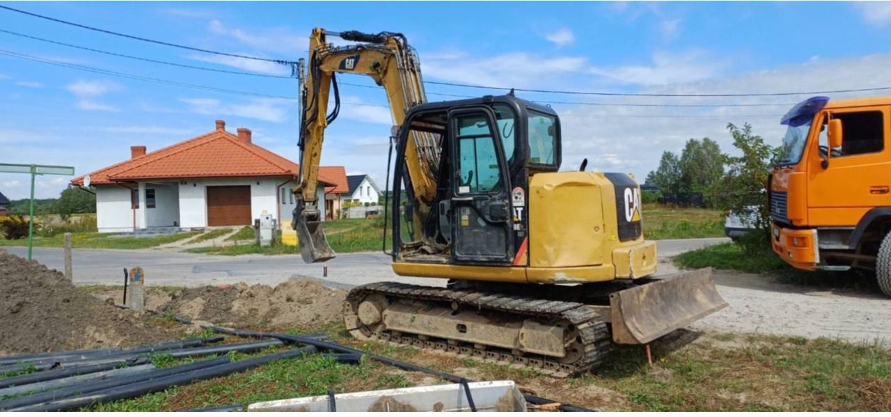 2013 Caterpillar 308E2CR crawler excavator, side view 2013 Caterpillar 308E2CR crawler excavator, side view