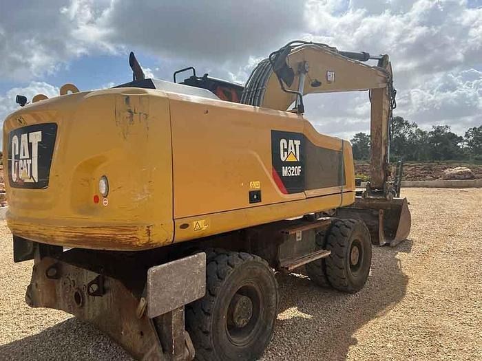 2016 Caterpillar M320F wheel excavator, rear three-quarter view 2016 Caterpillar M320F wheel excavator, rear three-quarter view