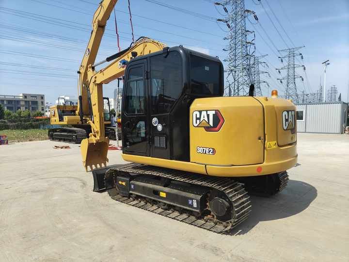 2023 Caterpillar 307E2 excavator, rear three-quarter view 2023 Caterpillar 307E2 excavator, rear three-quarter view
