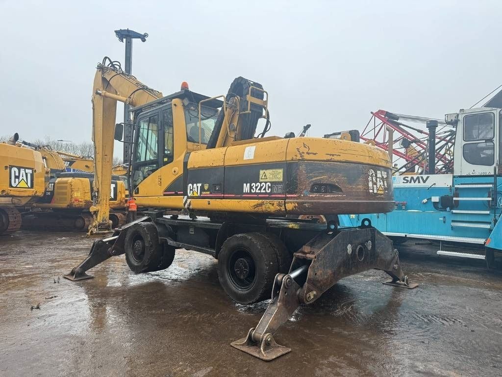 2005 Caterpillar M322C material handler, rear three-quarter view