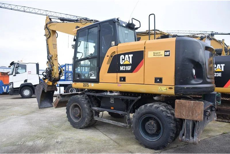 2018 Caterpillar M316F wheel excavator, rear three-quarter view 2018 Caterpillar M316F wheel excavator, rear three-quarter view
