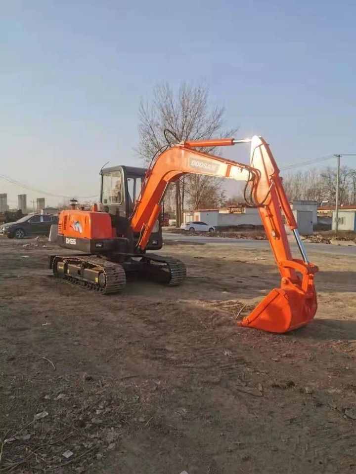 2023 Doosan DH55 mini excavator, three-quarter view