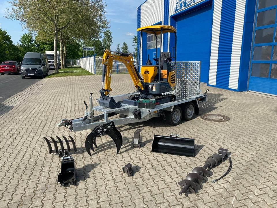 Berger Kraus BK1250JS mini excavator on trailer with attachments