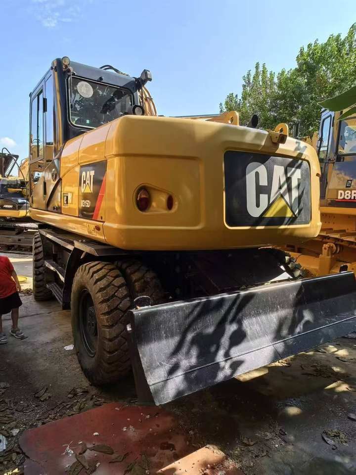 2019 Caterpillar M315D wheel excavator, rear three-quarter view 2019 Caterpillar M315D wheel excavator, rear three-quarter view