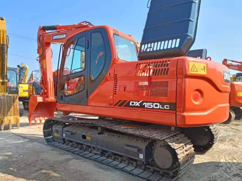2023 Doosan DX150LC crawler excavator, rear three-quarter view 2023 Doosan DX150LC crawler excavator, rear three-quarter view
