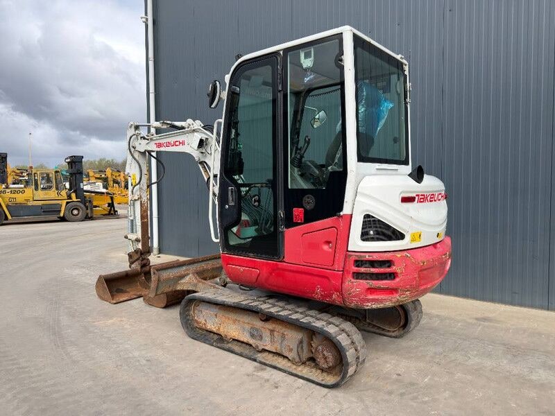 2017 Takeuchi TB230 mini excavator, rear three-quarter view 2017 Takeuchi TB230 mini excavator, rear three-quarter view