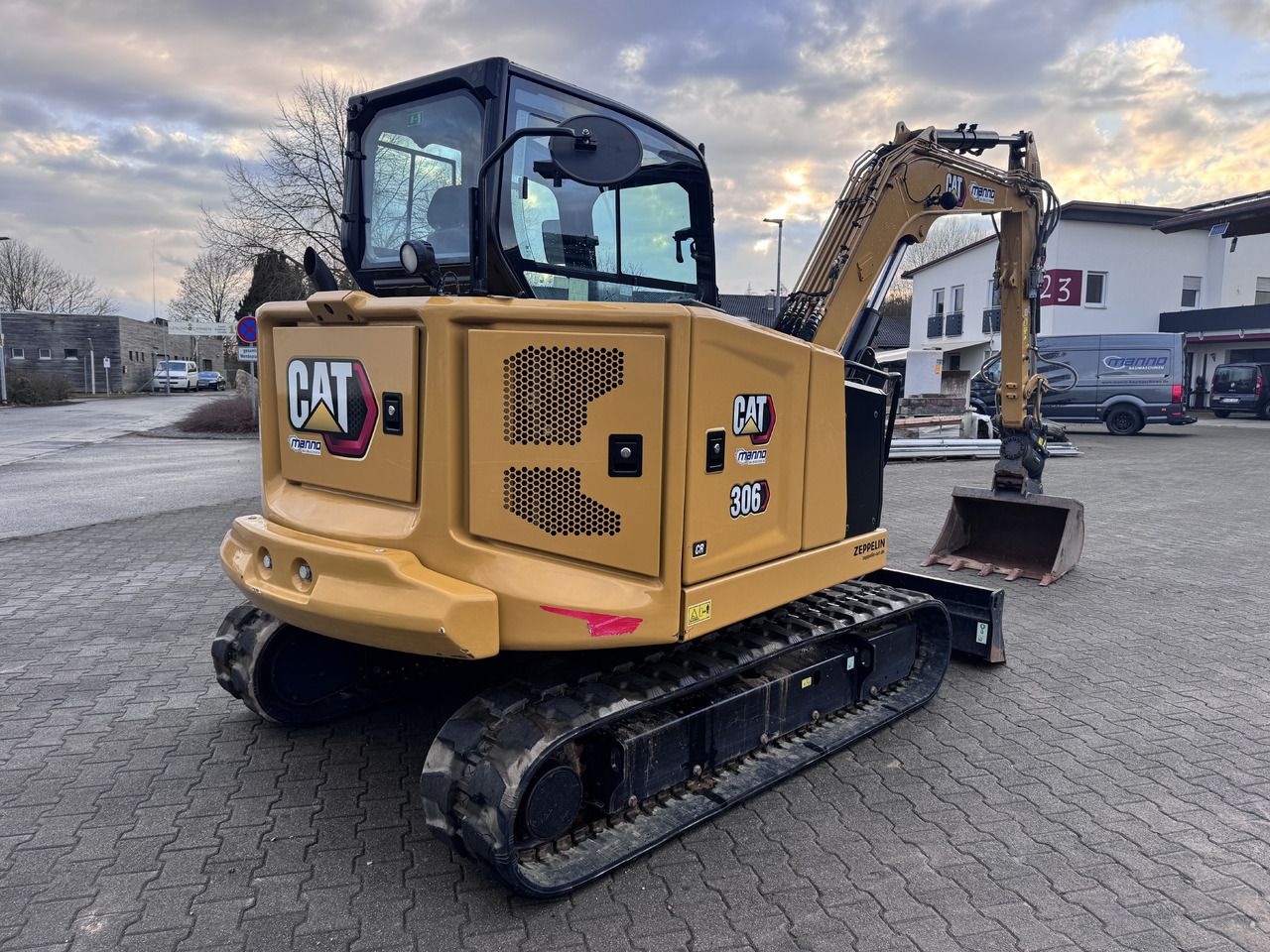 2022 Caterpillar 306 CR mini excavator, rear three-quarter view 2022 Caterpillar 306 CR mini excavator, rear three-quarter view