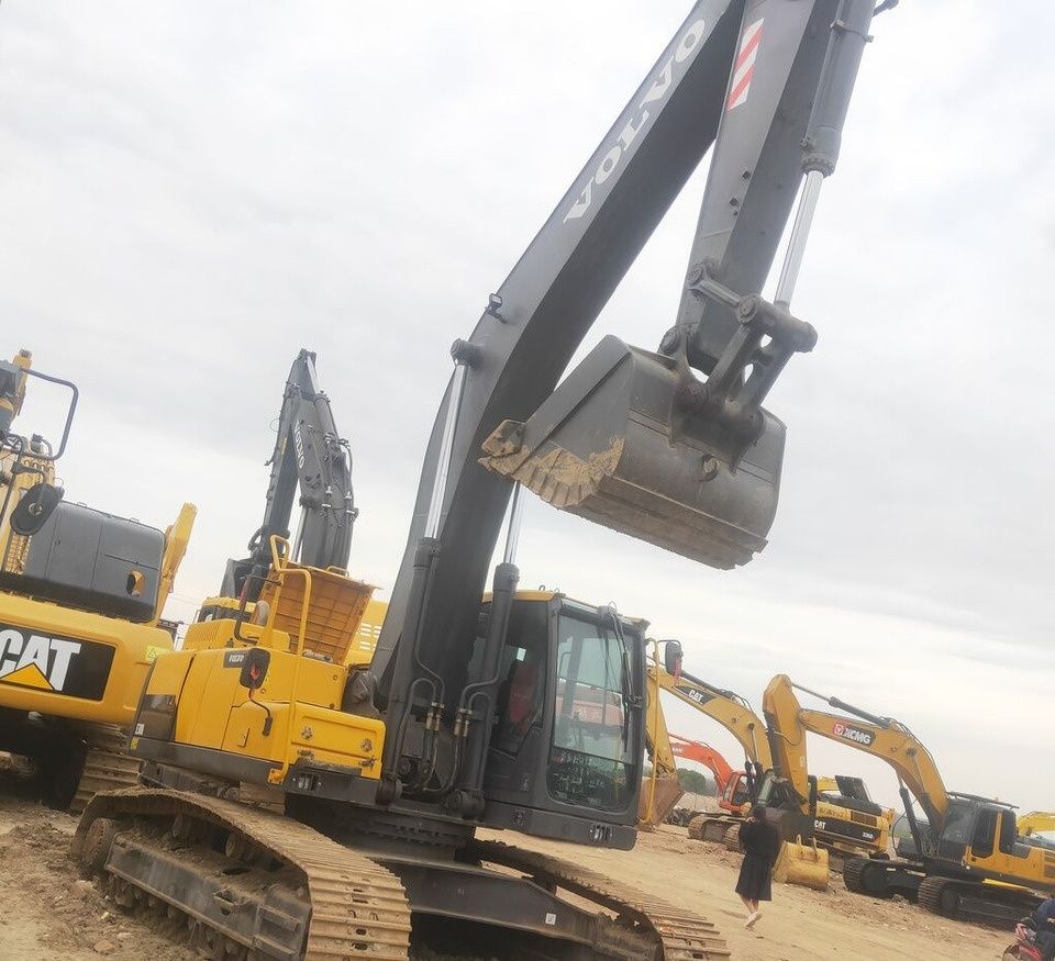 Volvo EC300 crawler excavator, low-angle side view Volvo EC300 crawler excavator, low-angle side view