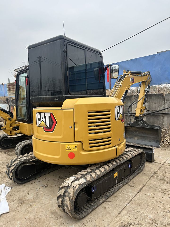 2024 Caterpillar 303.5ECR mini excavator, rear three-quarter view 2024 Caterpillar 303.5ECR mini excavator, rear three-quarter view