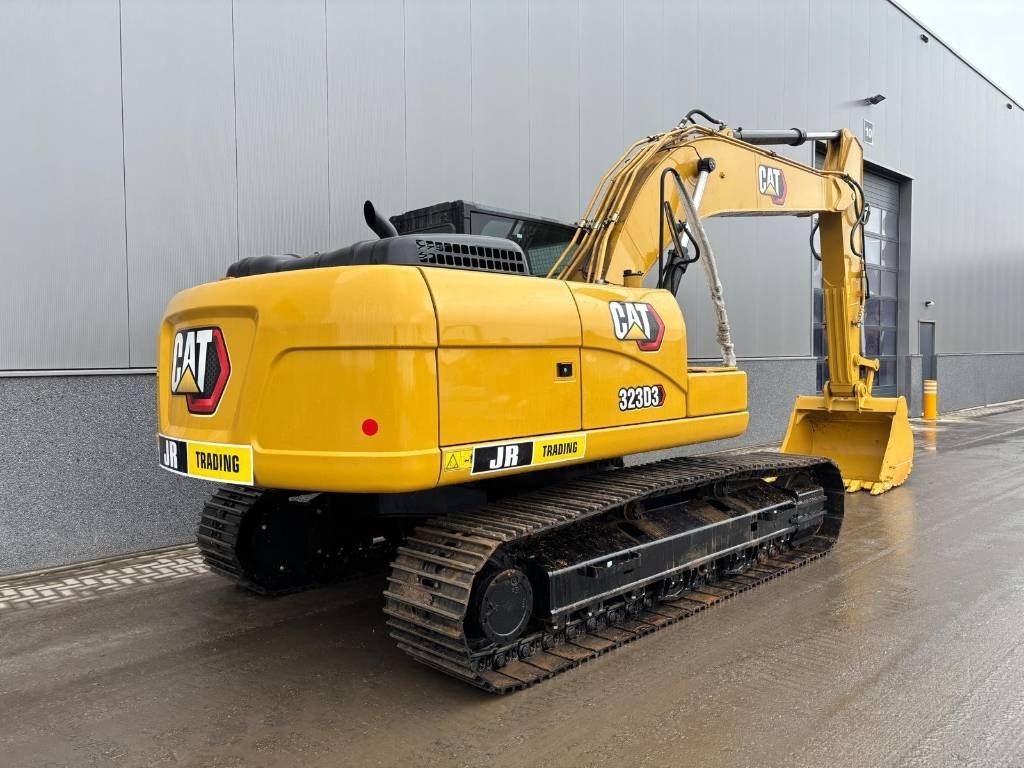 2026 Caterpillar 323D3 crawler excavator, rear three-quarter view 2026 Caterpillar 323D3 crawler excavator, rear three-quarter view