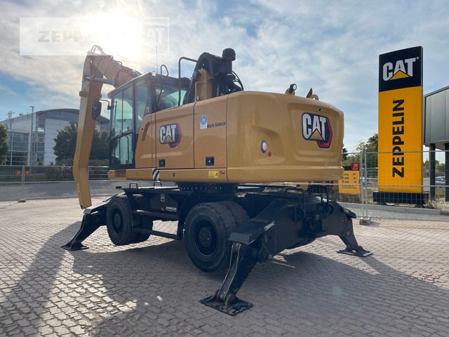 2021 Caterpillar MH3022-06C material handler, rear three-quarter view