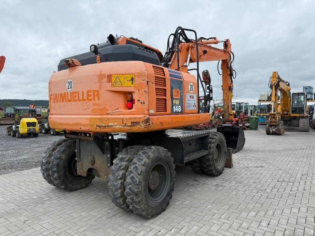 2013 Komatsu PW148-8 wheel excavator, rear three-quarter view