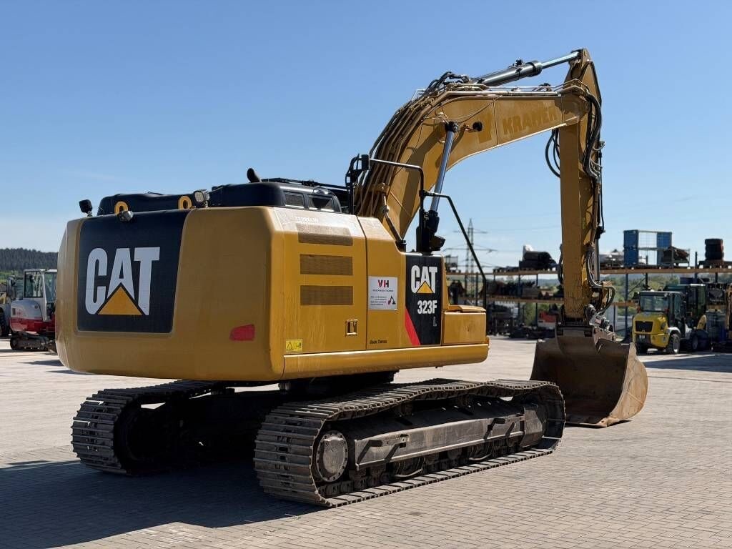 2017 Caterpillar 323FL crawler excavator, rear three-quarter view 2017 Caterpillar 323FL crawler excavator, rear three-quarter view