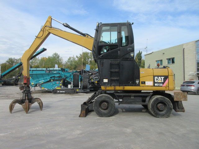 2009 Caterpillar M313D material handler, side view 2009 Caterpillar M313D material handler, side view