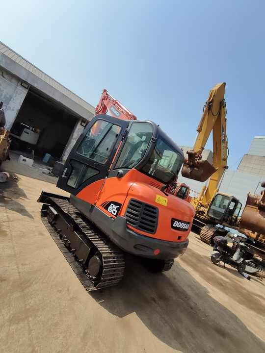 2022 Doosan DX60 crawler excavator, high-angle front view 2022 Doosan DX60 crawler excavator, high-angle front view