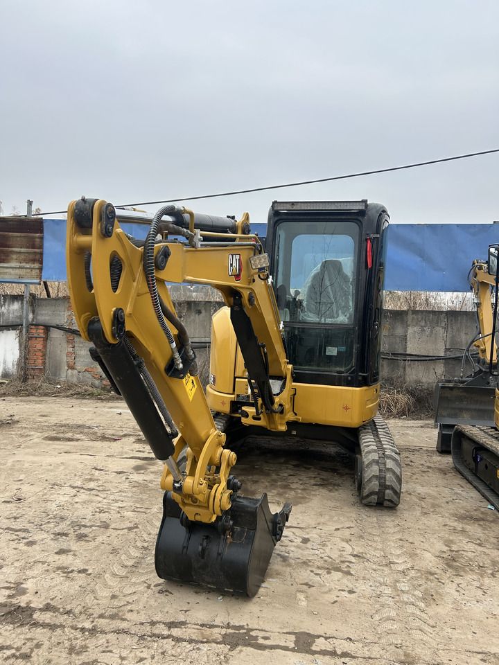 2023 Caterpillar 303.5ECR mini excavator, front three-quarter view