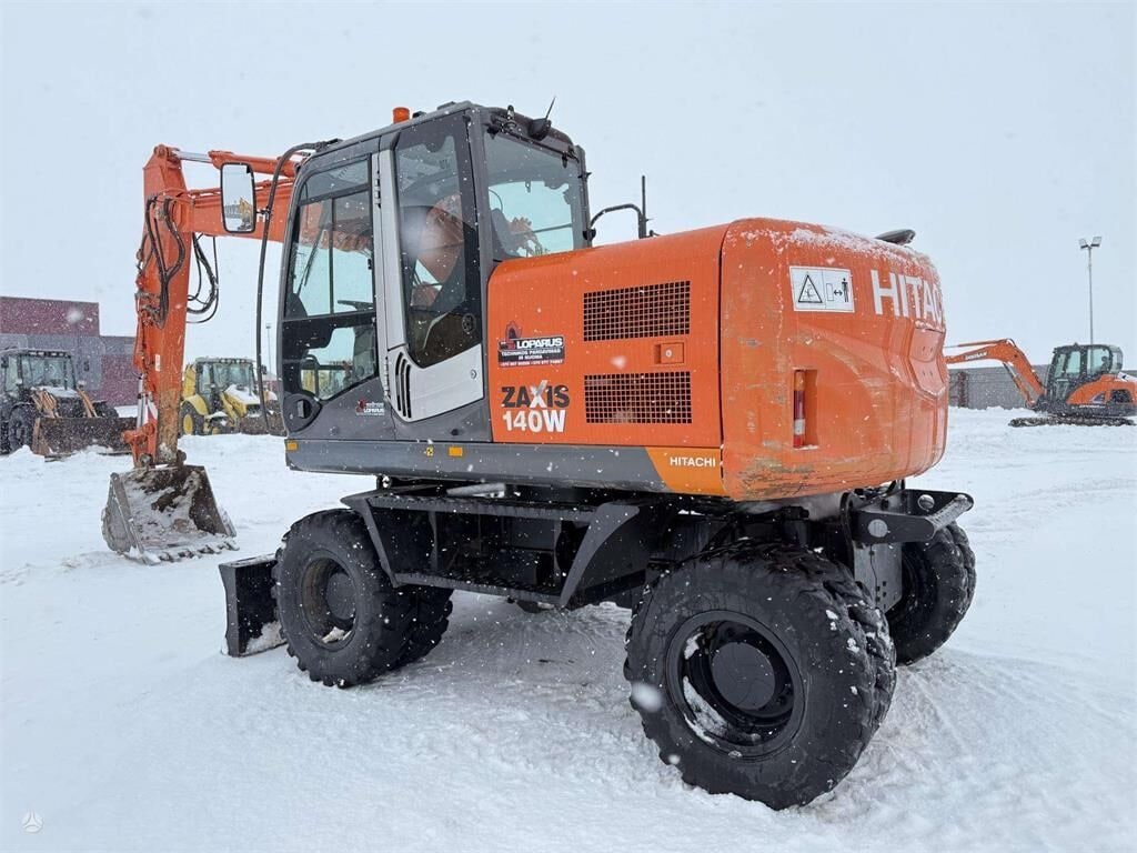 2010 Hitachi Zaxis 140W wheel excavator, side view 2010 Hitachi Zaxis 140W wheel excavator, side view