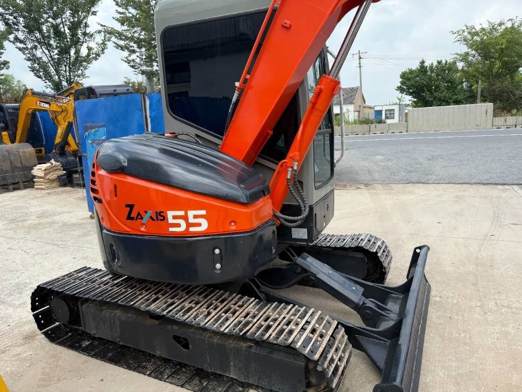 2023 Hitachi Zaxis 55 mini excavator, rear three-quarter view 2023 Hitachi Zaxis 55 mini excavator, rear three-quarter view
