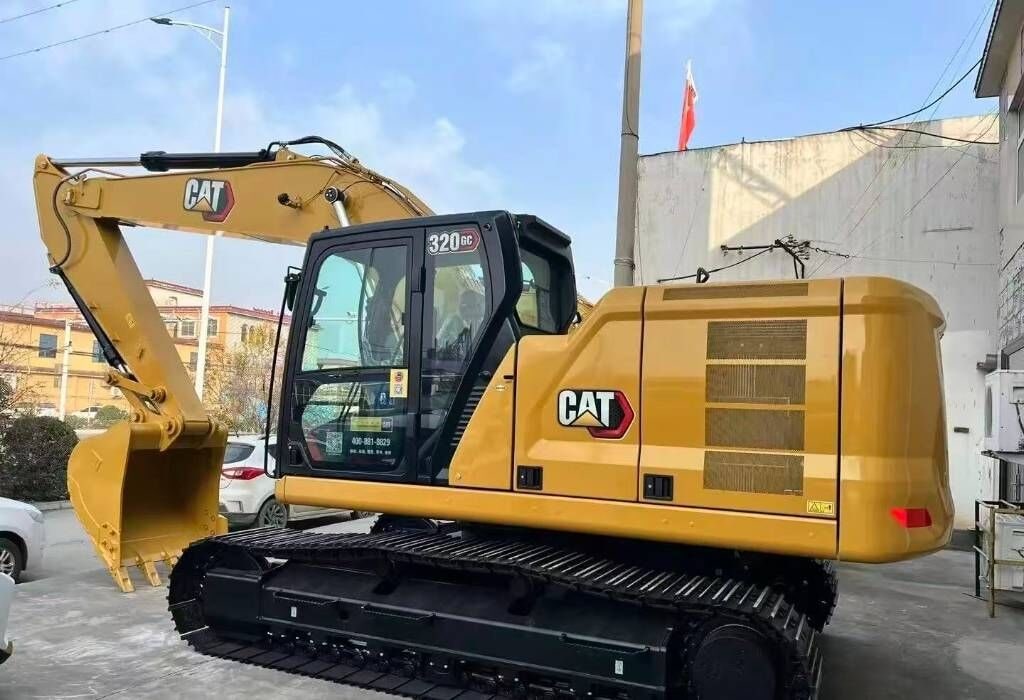 2025 Caterpillar 320GC crawler excavator, side profile view