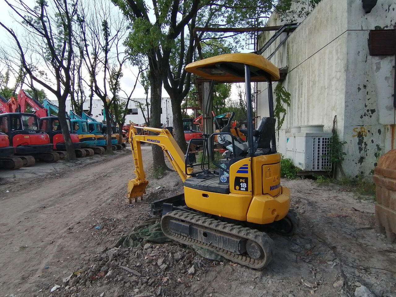 2024 Komatsu PC18MR-2 excavator, rear three-quarter view 2024 Komatsu PC18MR-2 excavator, rear three-quarter view