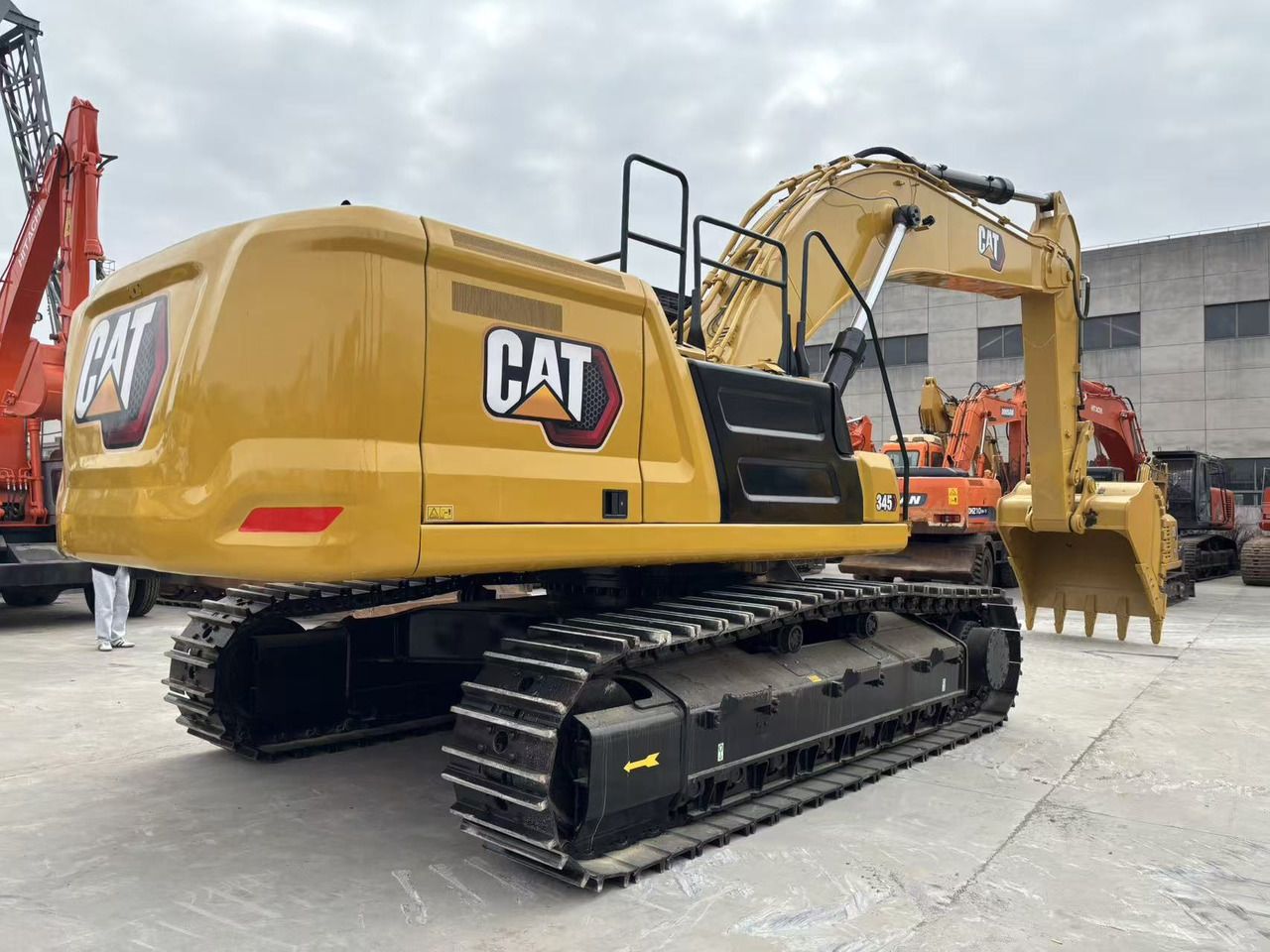 2023 Caterpillar 345GC crawler excavator, rear three-quarter view 2023 Caterpillar 345GC crawler excavator, rear three-quarter view