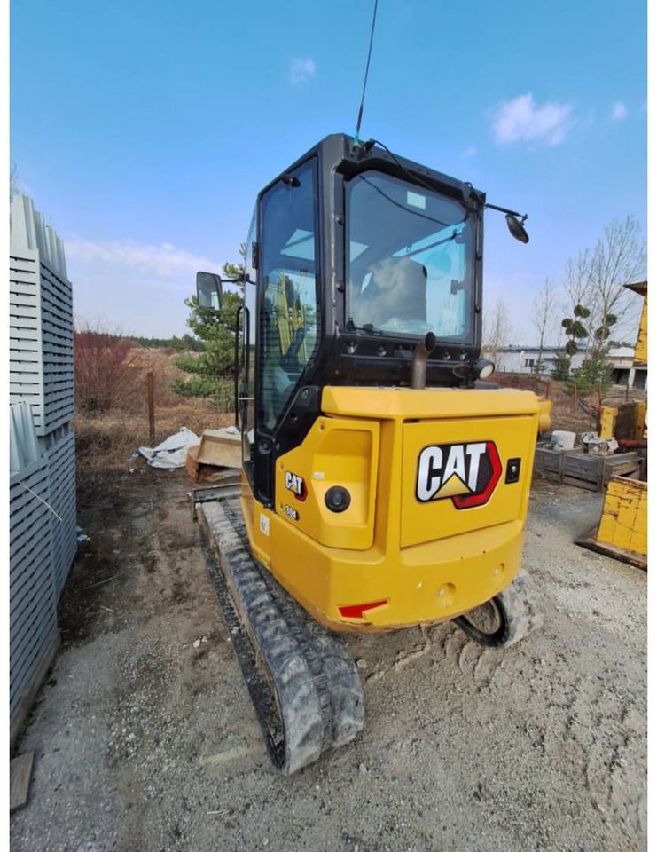 2022 Caterpillar 304 crawler excavator, rear three-quarter view 2022 Caterpillar 304 crawler excavator, rear three-quarter view