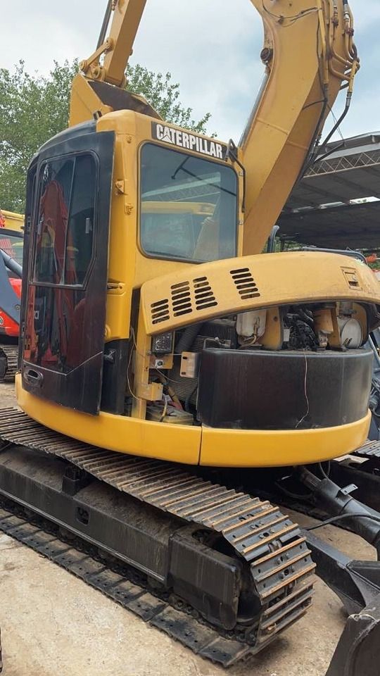 2023 Caterpillar 308C mini excavator, side view with open engine compartment 2023 Caterpillar 308C mini excavator, side view with open engine compartment