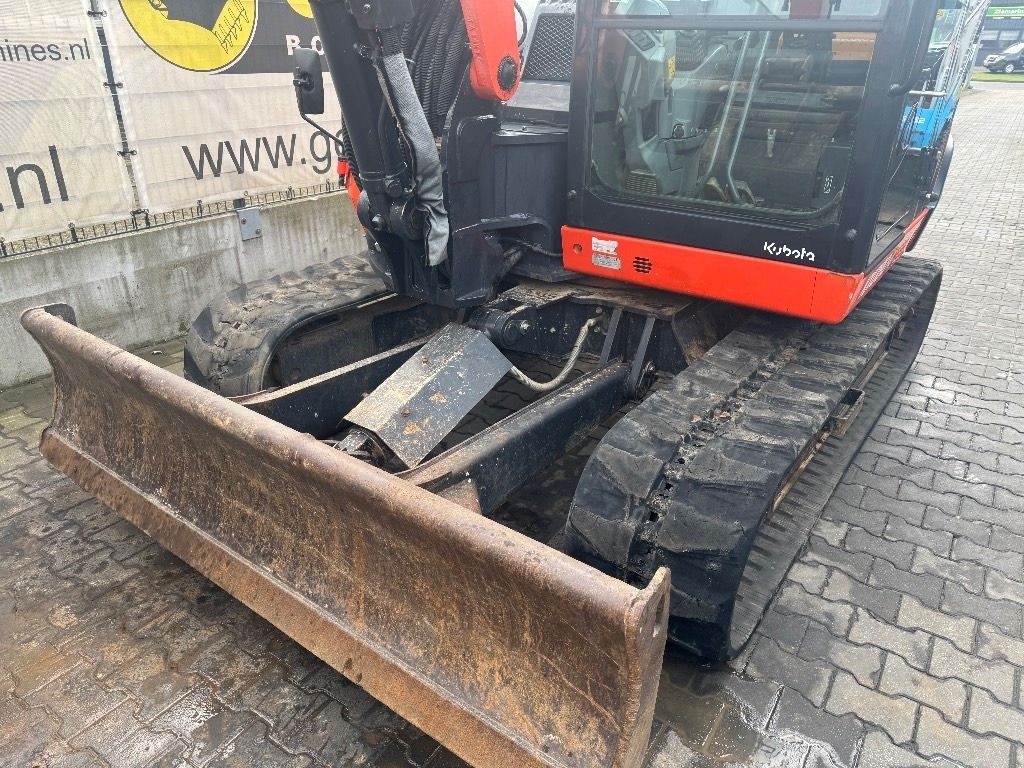 2015 Kubota KX080-4 mini excavator front view with blade 2015 Kubota KX080-4 mini excavator front view with blade